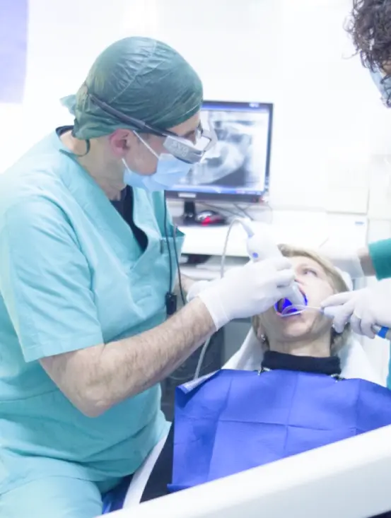 dental assistant with patient